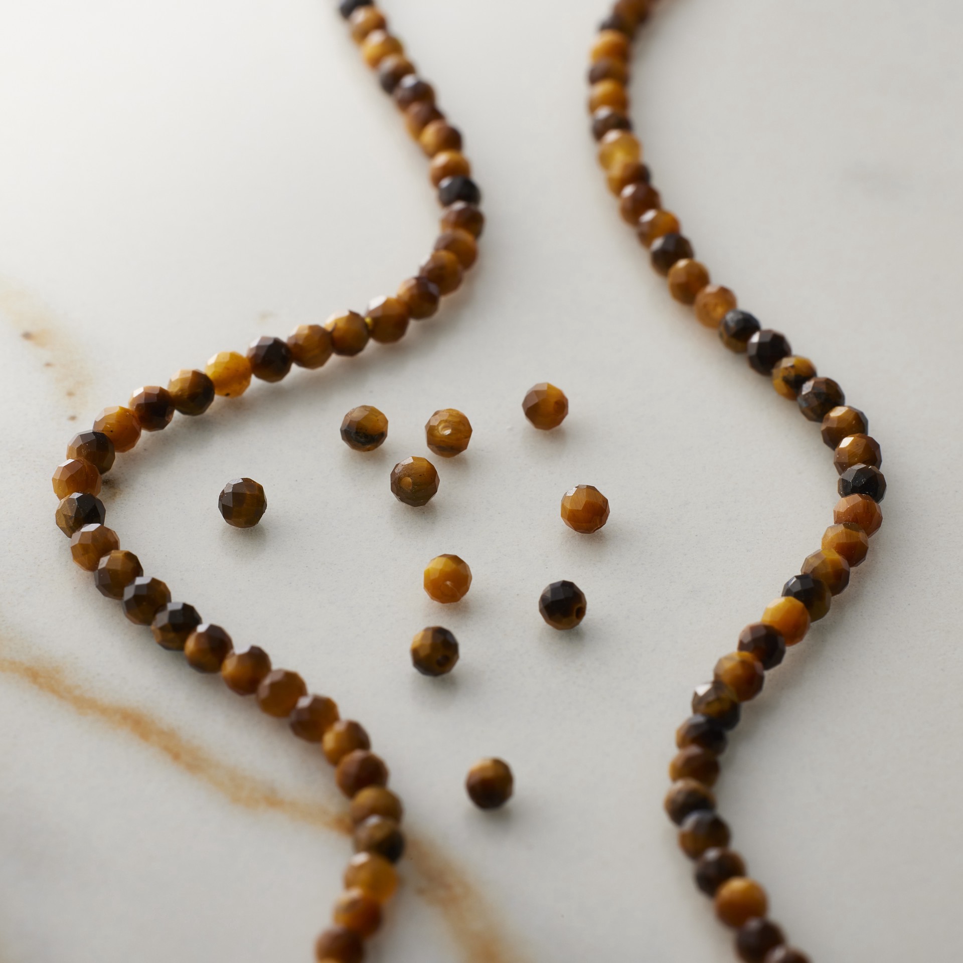 slide 3 of 3, Tiger's Eye Faceted Round Beads, 2mm By Bead Landing, 2mm