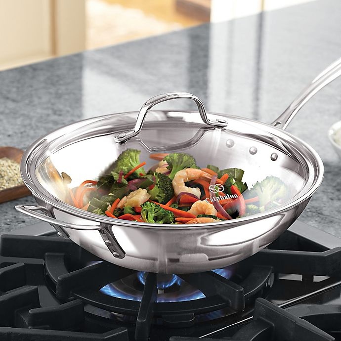 slide 3 of 6, Calphalon Tri-Ply Stainless Steel Stir Fry Pan with Lid, 12 in