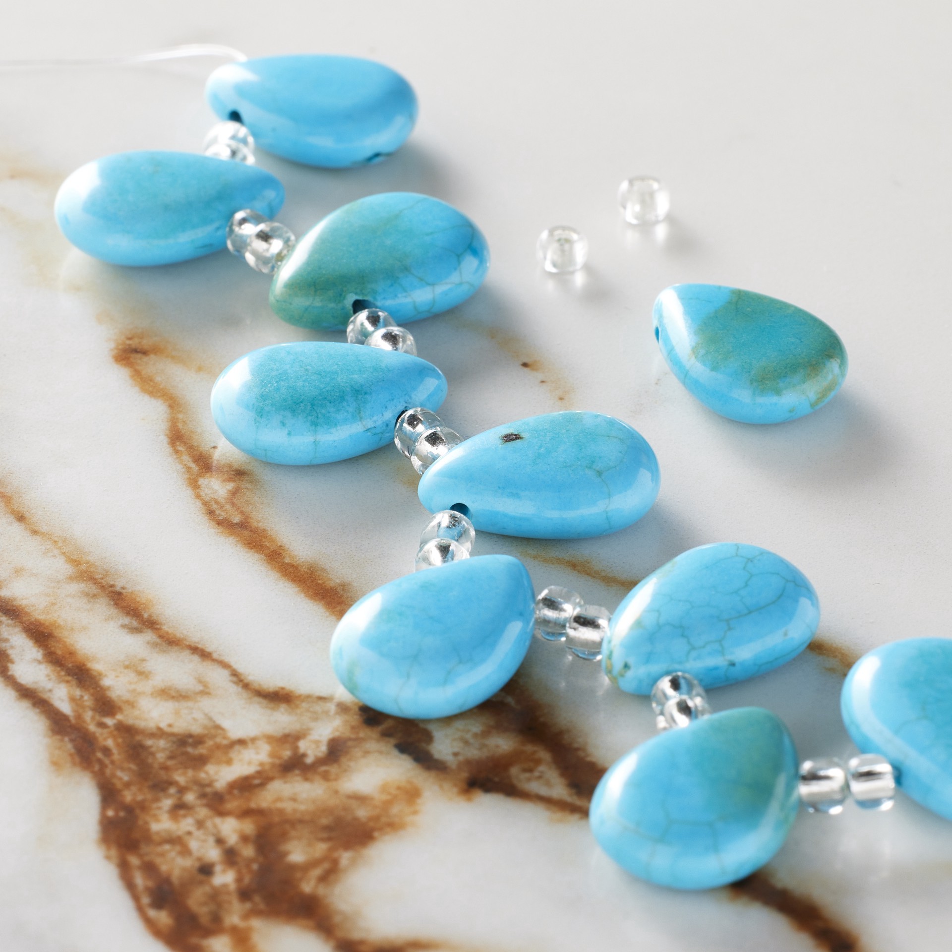 slide 3 of 3, Turquoise Dyed Reconstituted Howlite Teardrop Beads, 17mm By Bead Landing, 17mm