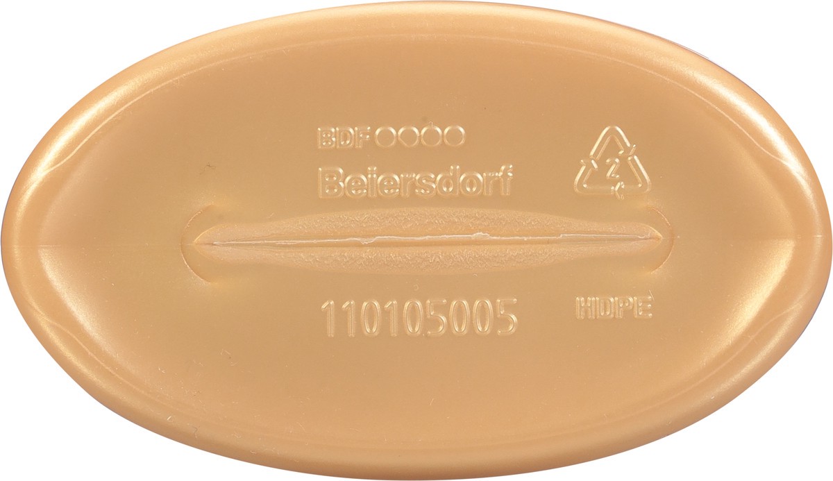 slide 5 of 9, Nivea Skin Firming Melanin Beauty & Hydration Body Lotion with Q10 and Argan Oil, 16.9 Fl Oz Pump Bottle, 16.9 oz