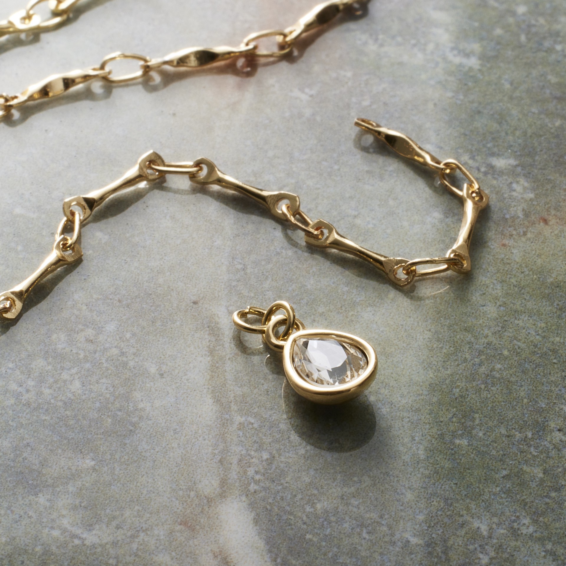 slide 5 of 5, 14k Gold Plated Clear Austrian Crystal Pear Charm By Bead Landing, 1mm x 5mm