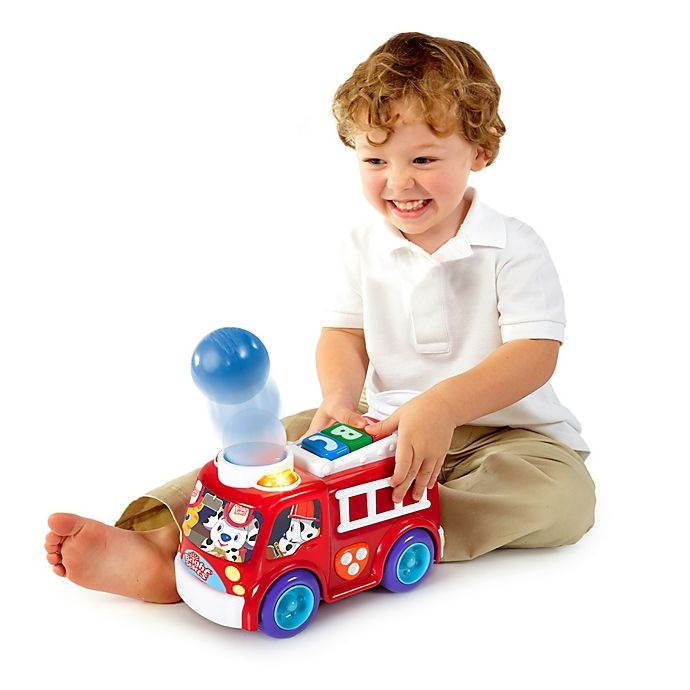 slide 2 of 5, Bright Starts Having a Ball Roll & Pop Fire Truck Toy, 4 ct