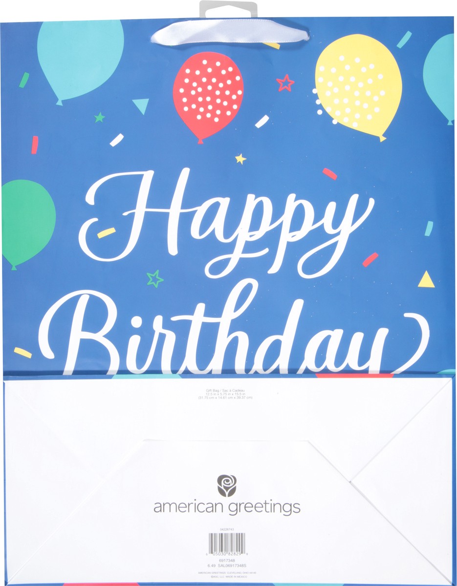 slide 9 of 9, American Greetings Give them extra smiles with an extra large gift bag. This design features “Happy Birthday” written in white script against a blue background with colorful balloons. Accents of crystalline add some sparkle and shine. This gift bag is the ideal size for giving large toys, clothing, blankets, electronics, or any oversized gift. Simply add some tissue paper (sold separately) to finish the look, and you're ready to make someone's day so much brighter., 1 ct