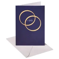 American Greetings Ring in their new lives together with this elegant wedding card. The design features two metallic gold wedding bands on a navy blue background and the words “I DO” on the front. The inside contains simple words of congratulations for the happy couple. It's suitable for sending to any twosome on their happy day. Envelope included.