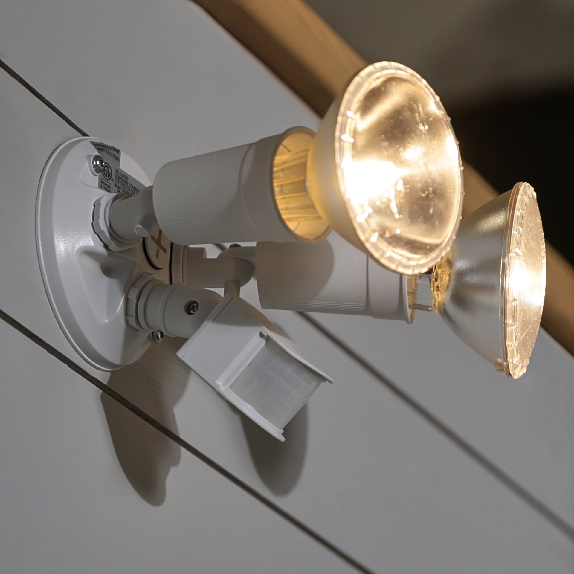 slide 5 of 6, Utilitech 110 -Degree 120 -Wattage Equivalent Hardwired Halogen white 2 -Head Motion-Activated Flood Light with Timer, 1 ct