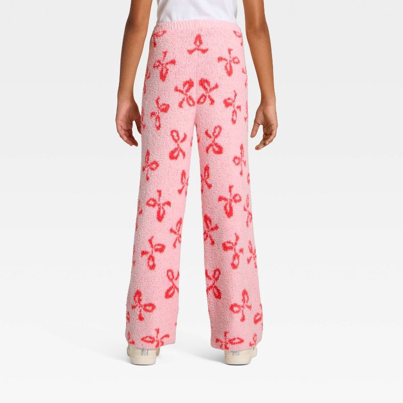 slide 2 of 3, Girls' The Grinch 'Cindy Lou Who' Bows Printed Boucle Pants - Light Pink L, 1 ct