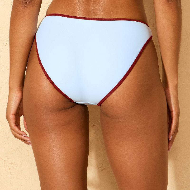 slide 2 of 5, Women's Contrast Binding Low-Rise High Leg Medium Coverage Bikini Bottom - Wild Fable™ Blue/Burgundy L, 1 ct