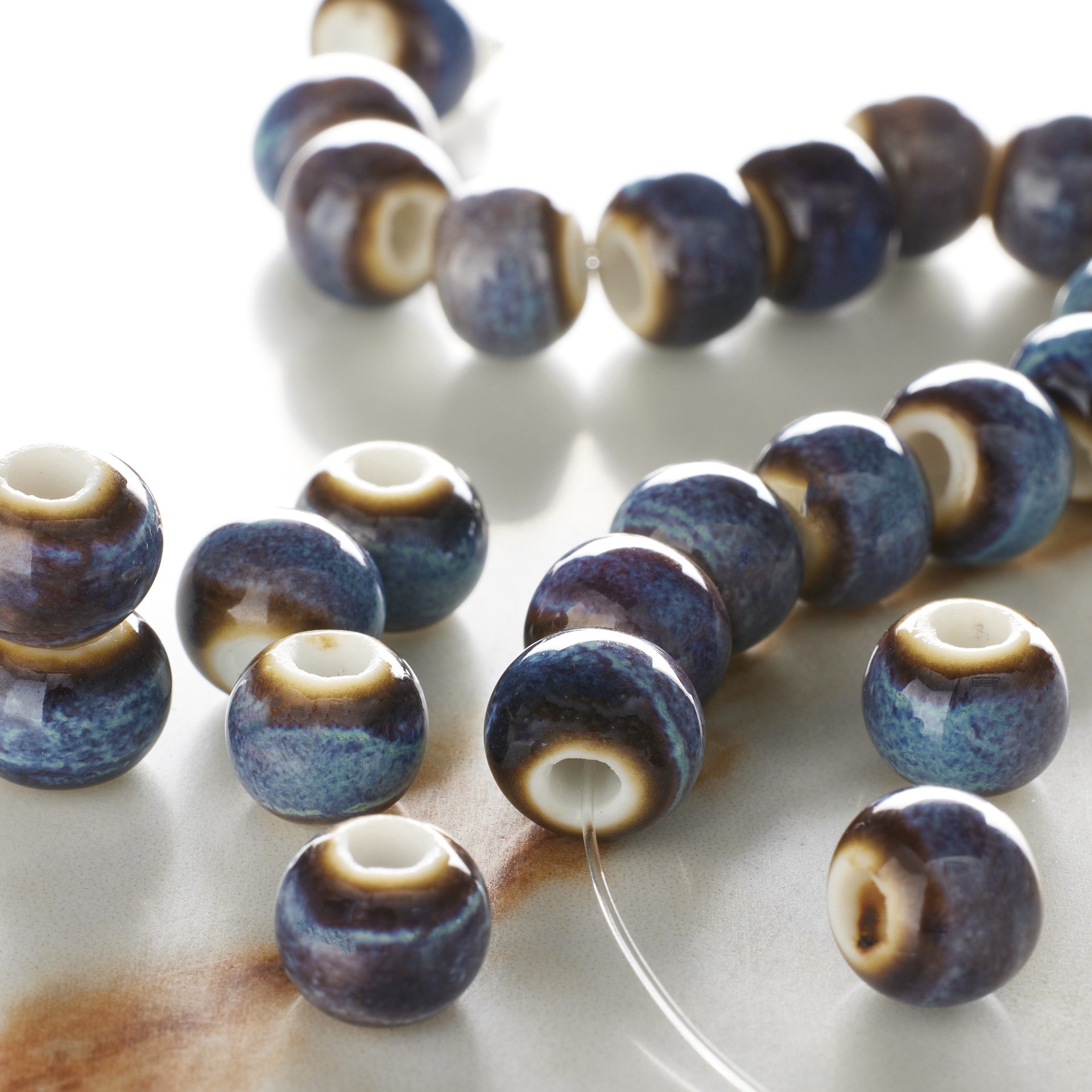 slide 2 of 3, Blue & Brown Ceramic Round Beads, 8mm By Bead Landing, 8mm