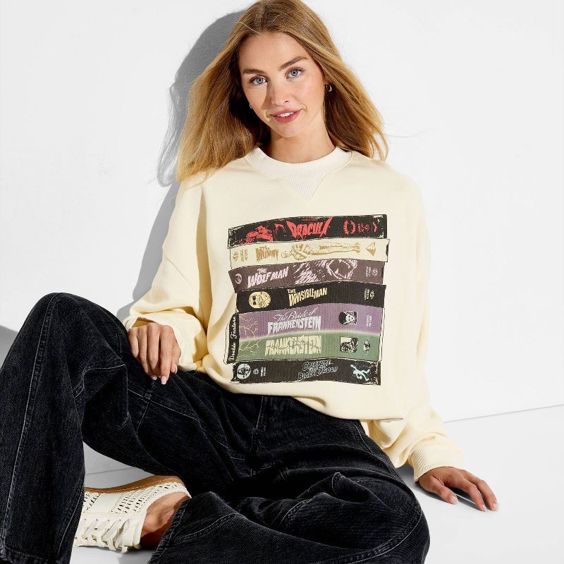 slide 1 of 3, Women's Crewneck Universal Monsters Graphic Pullover Sweatshirt - Off-White M, 1 ct