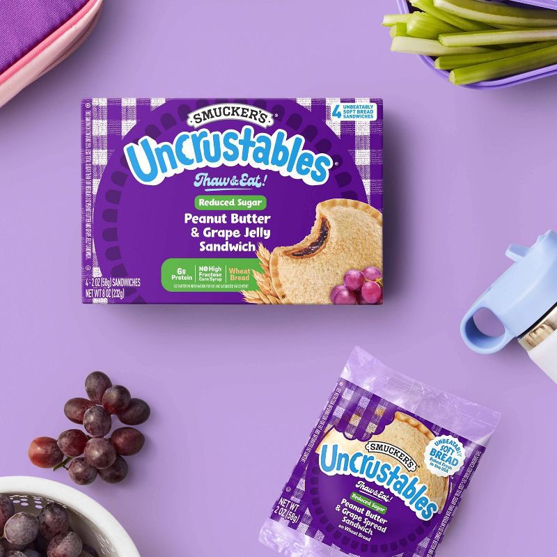 slide 3 of 9, Smucker's Uncrustables Frozen Whole Wheat Peanut Butter & Grape Jelly Sandwiches - 8oz/4ct, 4 ct; 8 oz