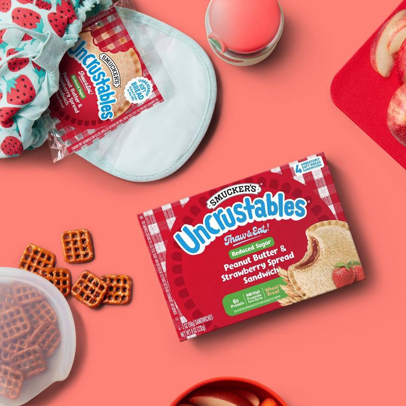 slide 3 of 9, Smucker's Uncrustables Frozen Whole Wheat Peanut Butter & Strawberry Jam Sandwich - 8oz/4ct, 4 ct; 8 oz