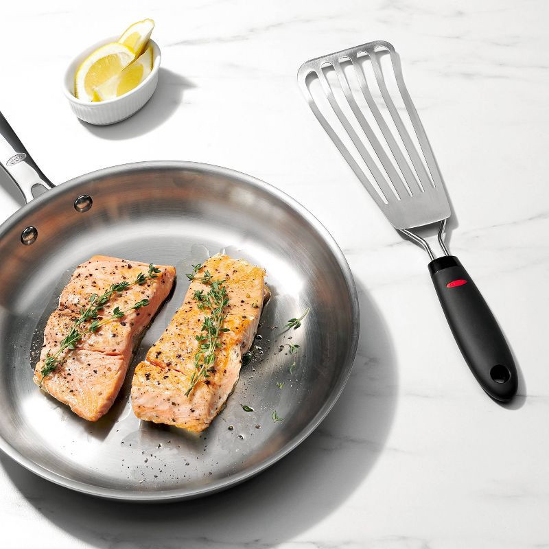 slide 2 of 6, OXO Fish Turner 13.65"x3.5": Stainless Steel Slotted Cooking Spatula, Dishwasher-Safe, Black Handle, 1 ct