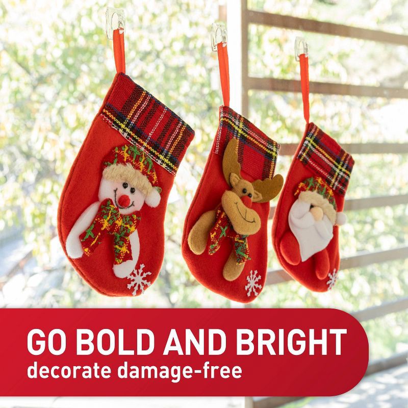 slide 3 of 9, Command Damage-Free Hanging Clear Mini Hooks with Adhesive Strips for Christmas Lights and Holiday Decoration, 1 ct