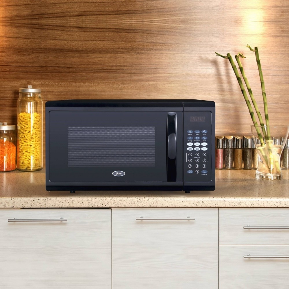 slide 7 of 9, Oster 1.1 cu ft 1100W Digital Microwave Oven - Black OGZJ1104, 1 ct