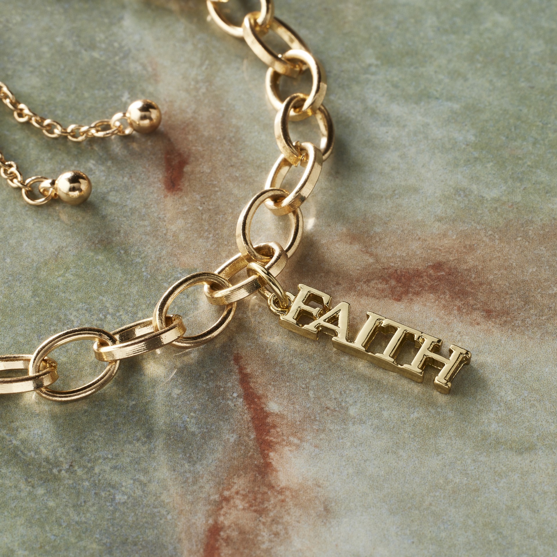 slide 5 of 8, 14k Gold Plated Faith Charm By Bead Landing, 1.12 in x 0.24 in x 0.24 in
