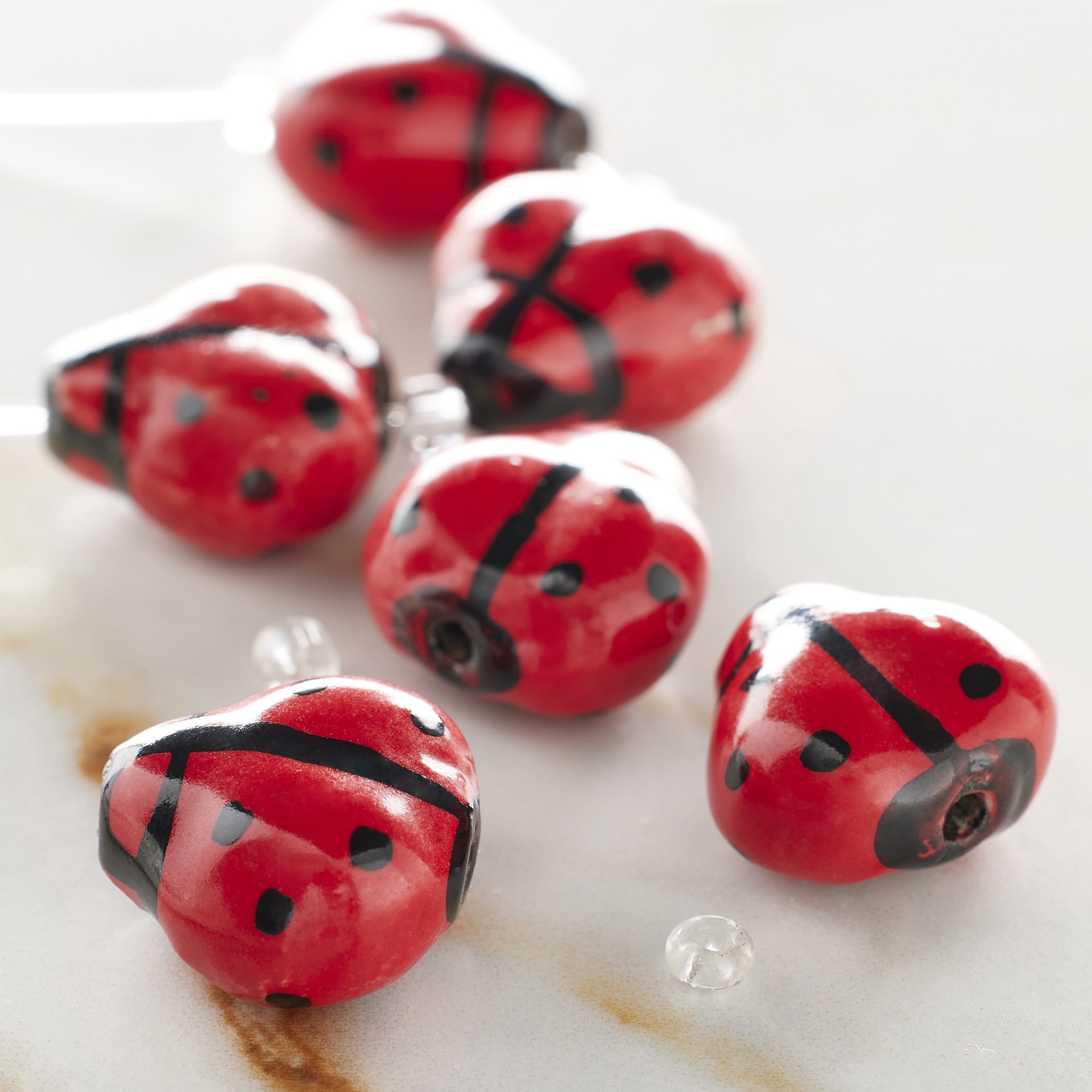 slide 2 of 3, Red Ladybug Ceramic Beads, 17mm By Bead Landing, 17mm