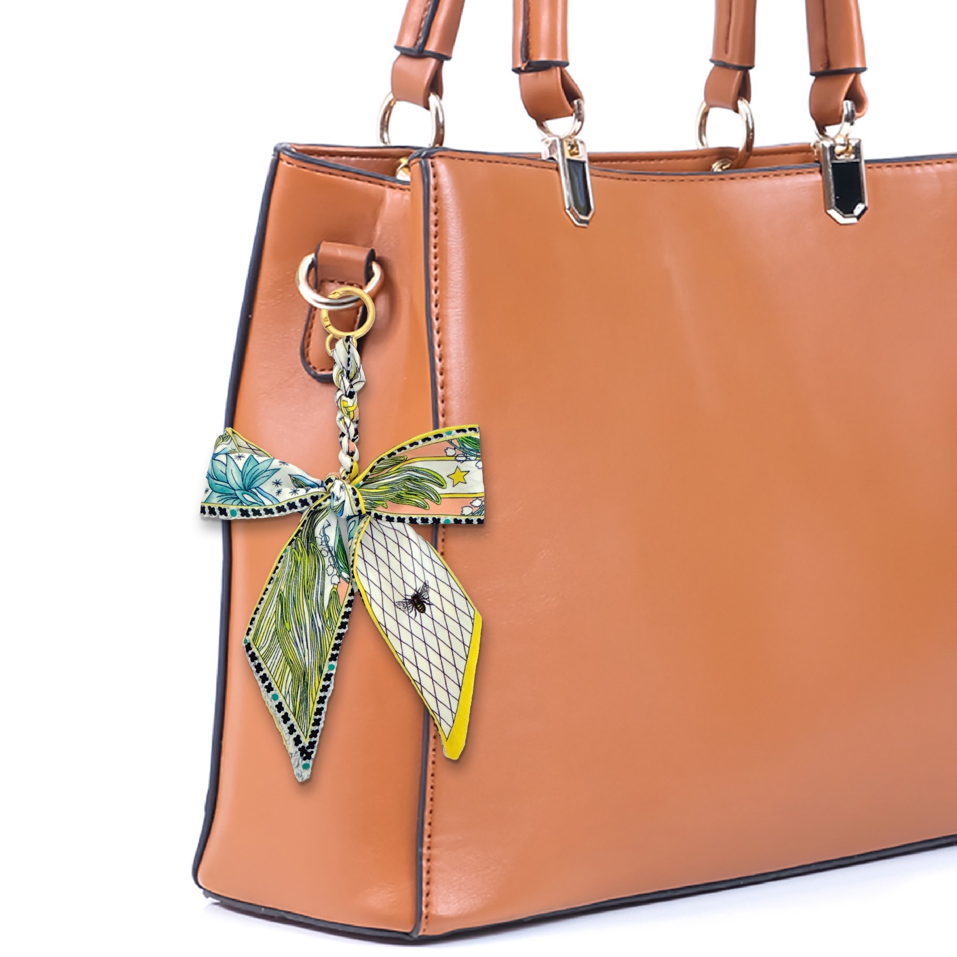 slide 2 of 3, Blue Moon Studio Yellow & Multicolor Leaf Print Bow Bag Charm, 9.5 in x 4.5 in x 0.5 in