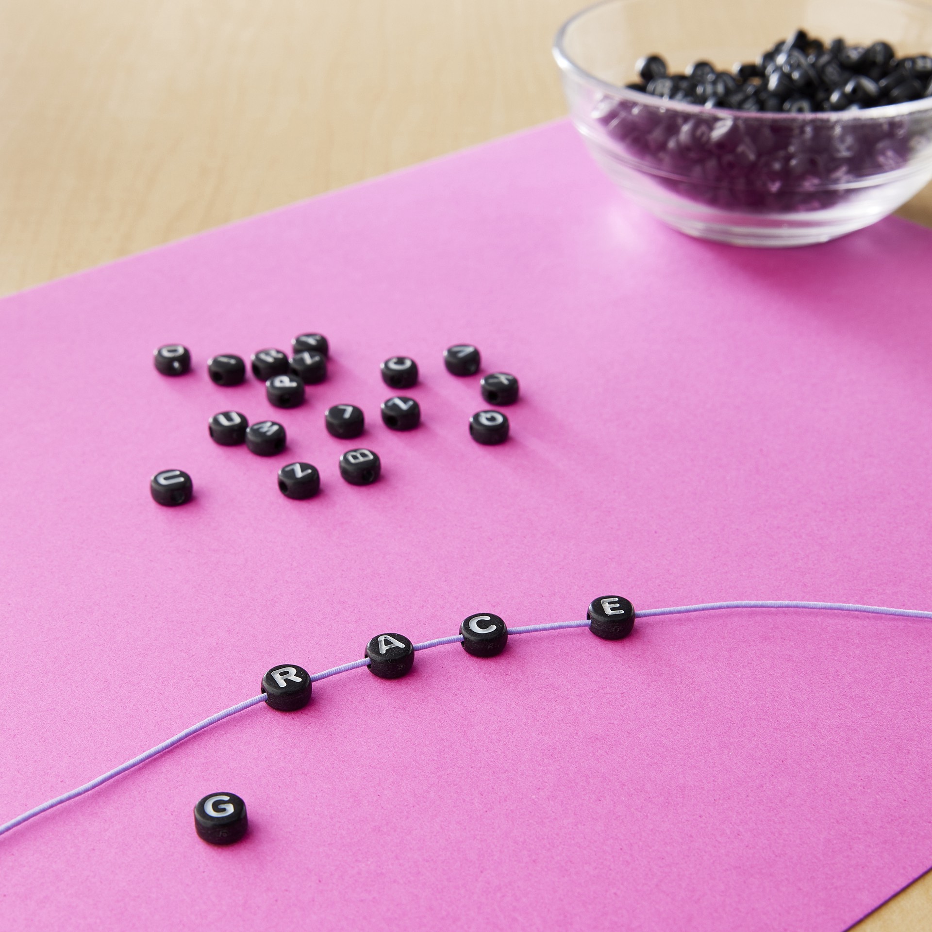 slide 3 of 3, 7.5mm Black Alphabet Circular Beads By Creatology, 7.5mm