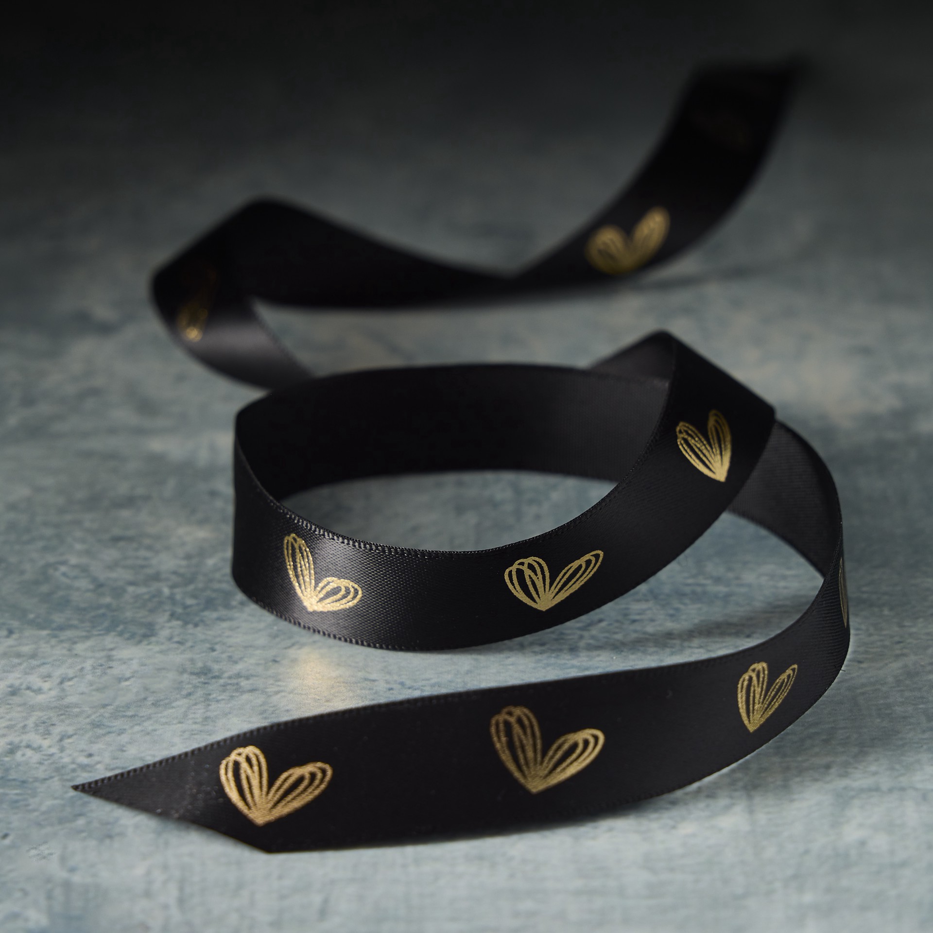 slide 2 of 2, 5/8" X 7yd. Black & Gold Heart Ribbon By Celebrate It Classic, 5/8 in x 7 yd