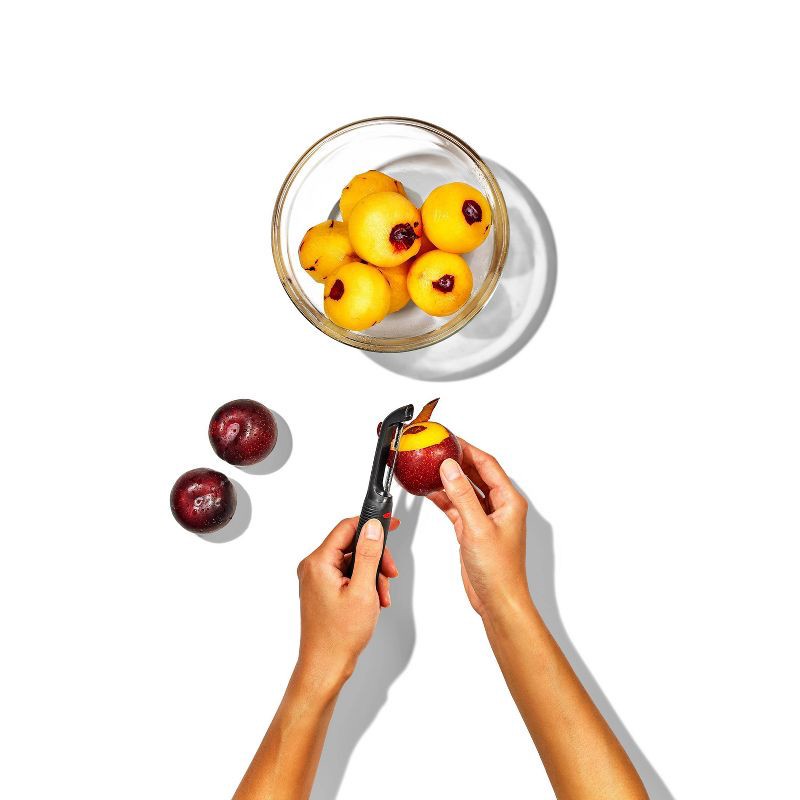 slide 4 of 8, OXO Softworks Serrated Peeler: Stainless Steel Vegetable & Potato Peeler, Dishwasher-Safe, Black Handle, OXO Kitchen Tool, 1 ct