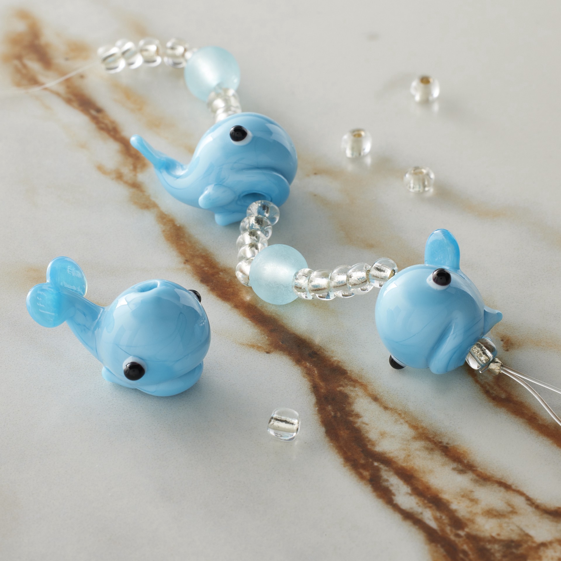 slide 2 of 3, Blue Lampwork Glass Whale Beads By Bead Landing, 13mm x 19mm