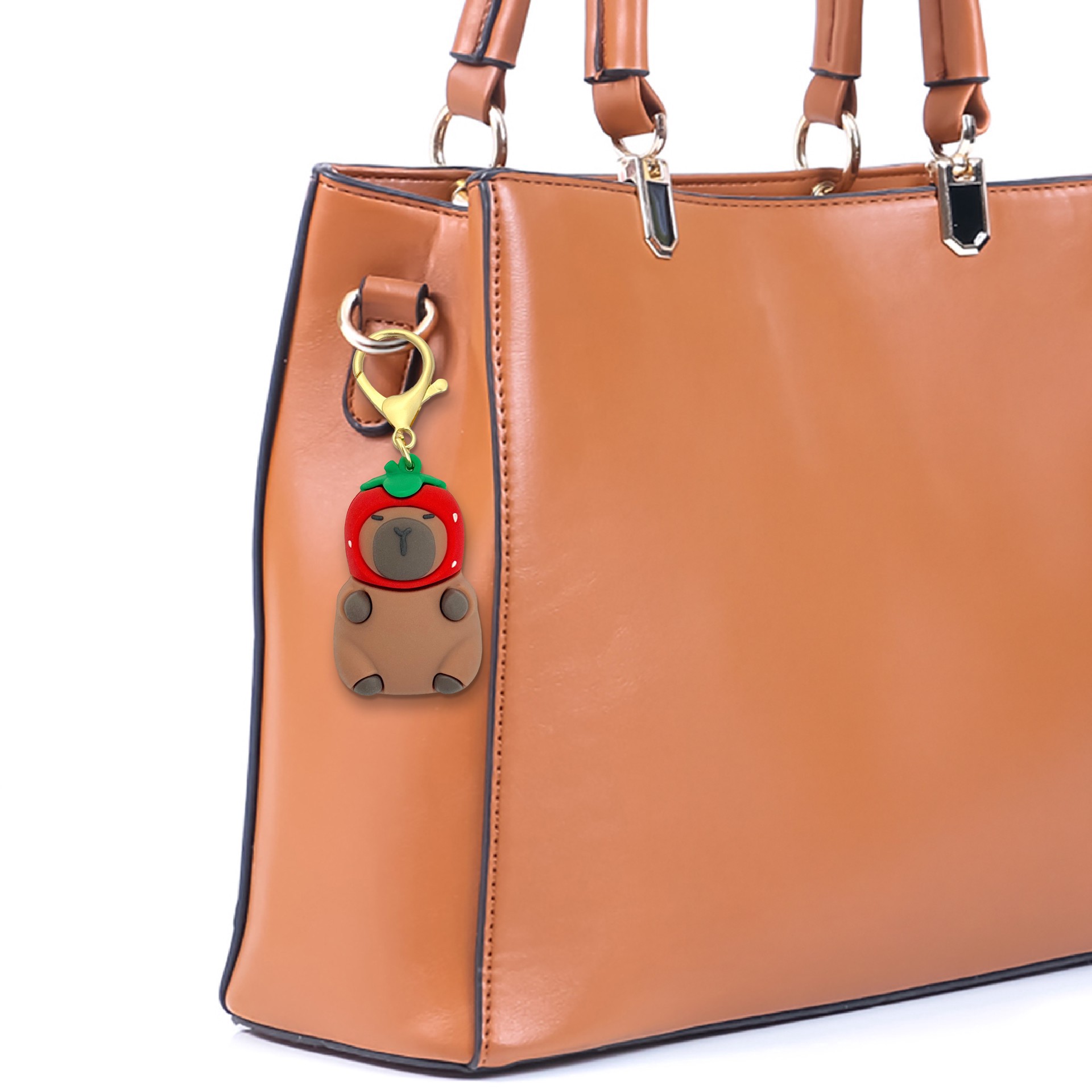 slide 3 of 3, Blue Moon Studio Capybara In Strawberry Hat Bag Charm, 2.25 in x 1.42 in