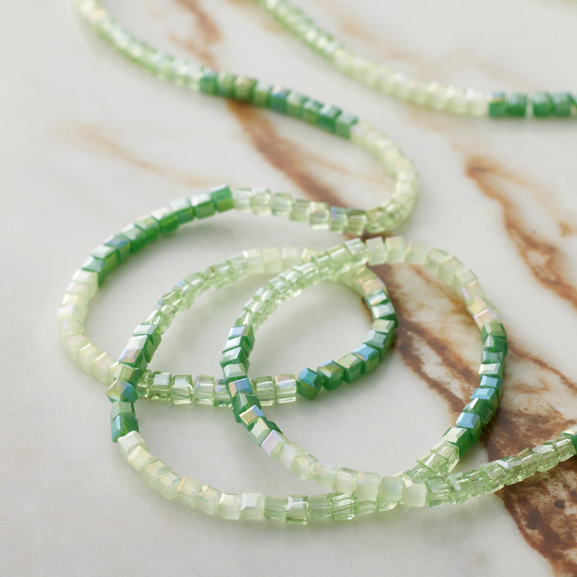 slide 3 of 3, Green Ombre Faceted Glass Cube Beads, 2mm By Bead Landing, 2mm