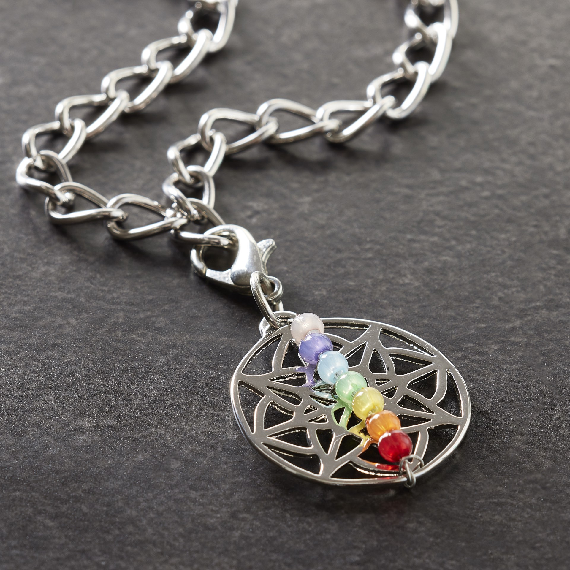 slide 3 of 3, Rhodium Chakra Charm By Bead Landing, 22 mm charm size