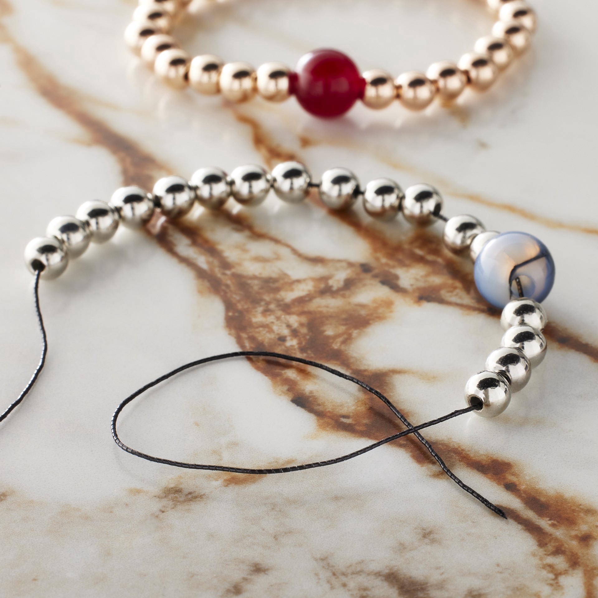 slide 2 of 3, 0.5mm Black Elastic Cord, 10yd. By Bead Landing, 0.5mm