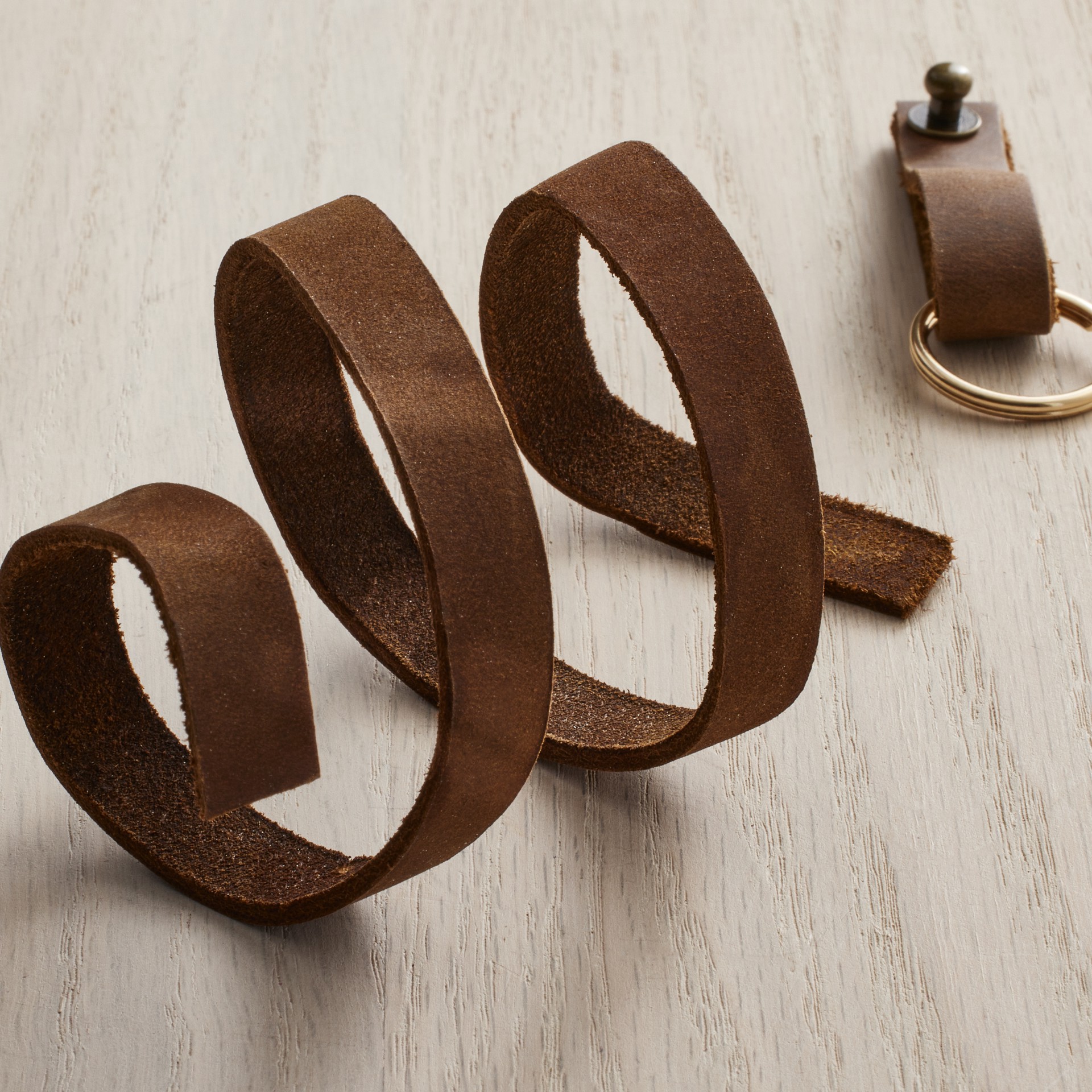 slide 2 of 6, Triumph Brown Leather Strip By Bead Landing, 0.5 in x 1 yd