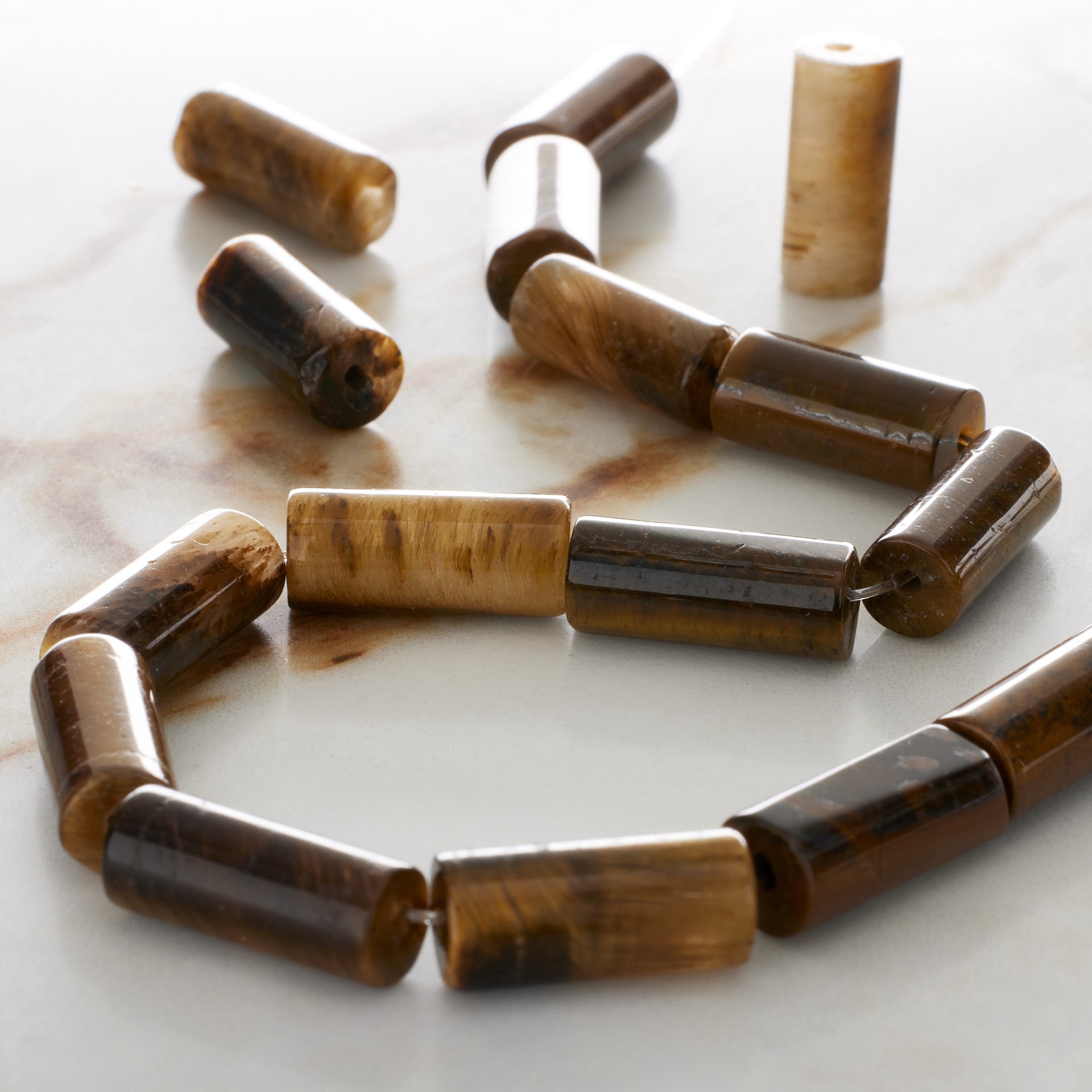 slide 3 of 3, Yellow Tiger's Eye Tube Beads By Bead Landing, 14mm x 6mm