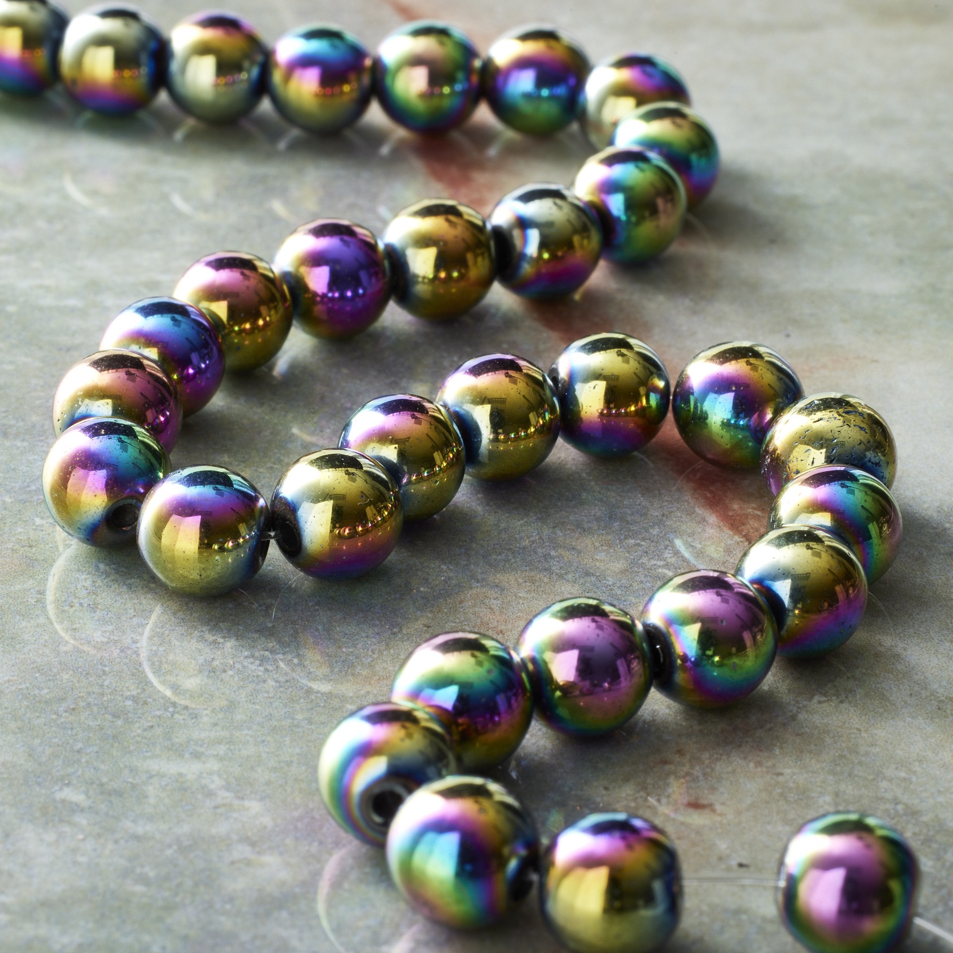 slide 3 of 3, Rainbow Reconstituted Hematite Round Beads By Bead Landing, 8 mm