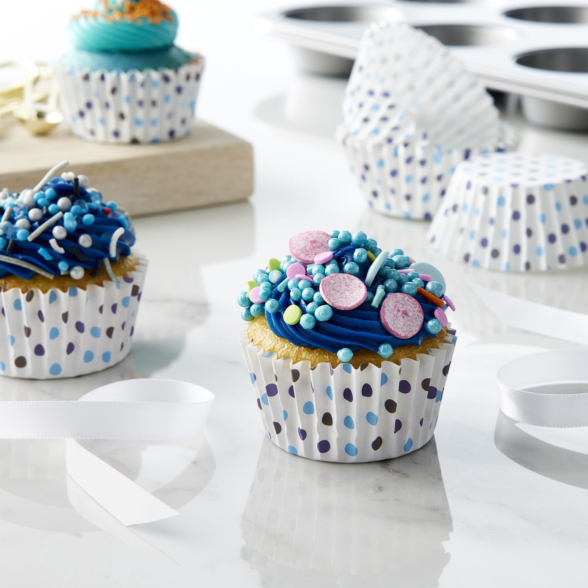 slide 2 of 3, Multi Blue Polka Dot Grease Resistant Baking Cups By Celebrate It, 1.97 in x 1.18 in