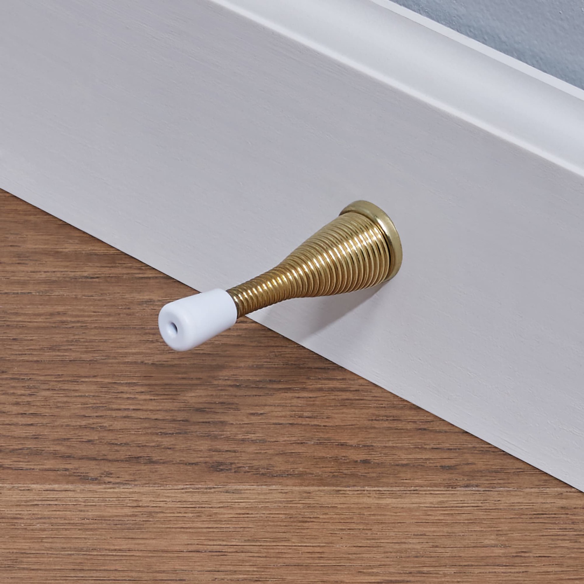 slide 3 of 6, RELIABILT 2-9/10-in Polished brass Spring Door Stop, 1 ct