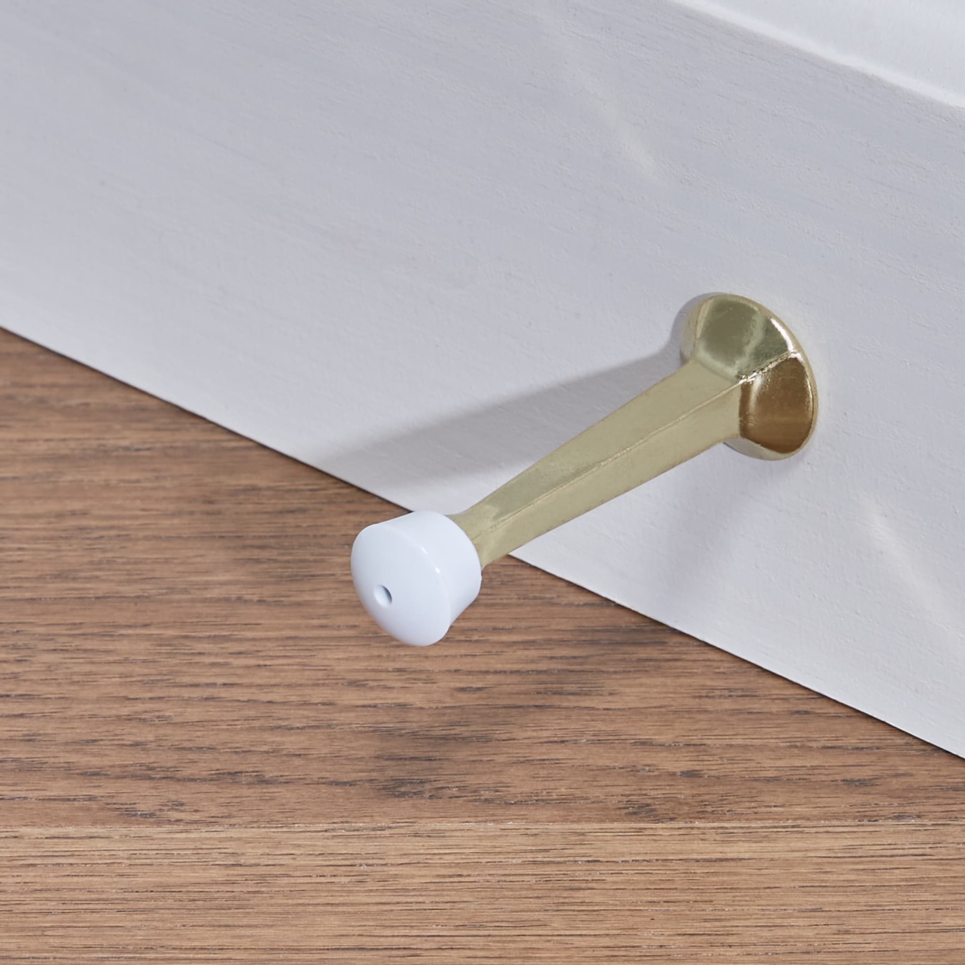 slide 3 of 6, RELIABILT 3-7/10-in Polished brass Rigid Door Stop, 1 ct