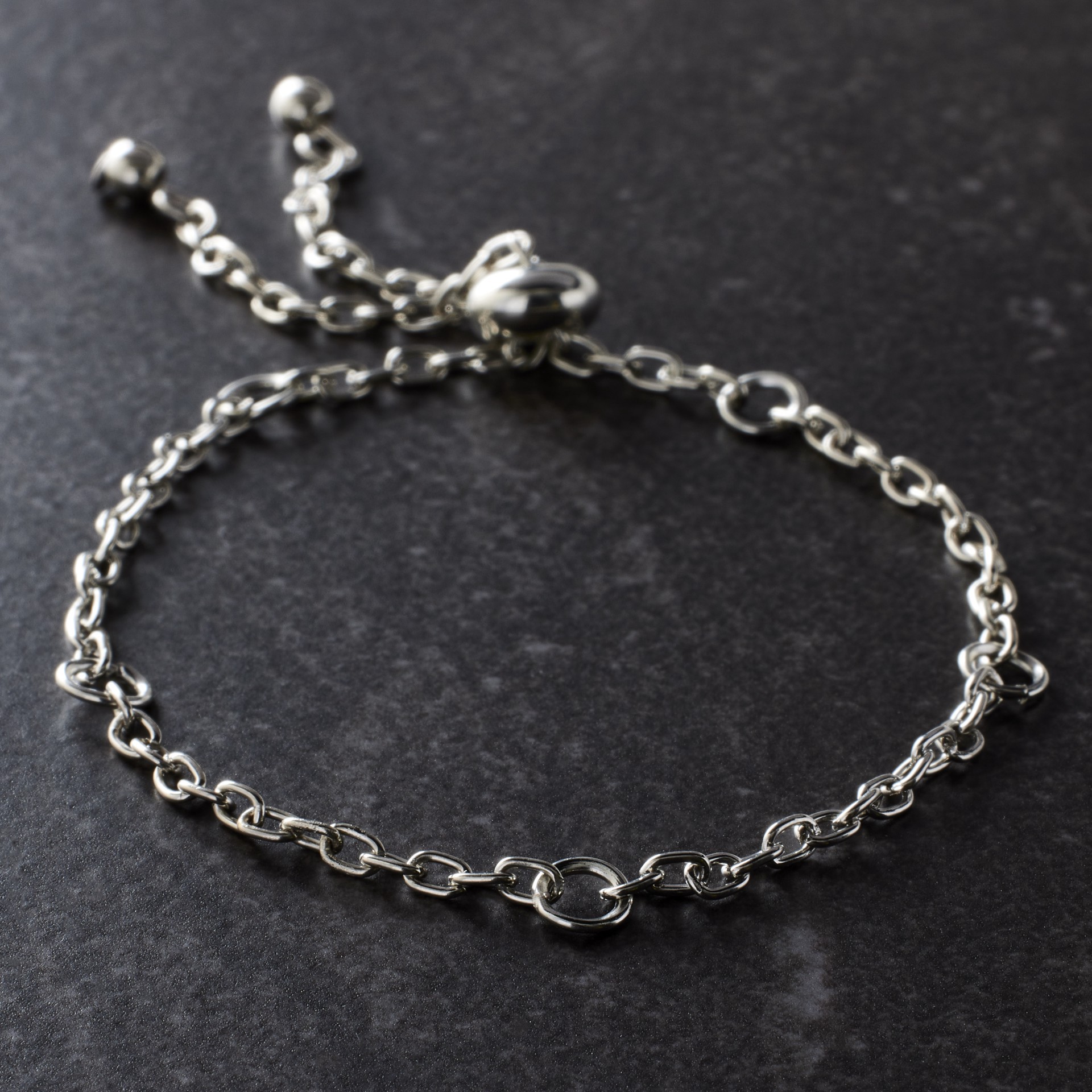 slide 2 of 3, 9" Rhodium Slider Charm Bracelet By Bead Landing, 9 in