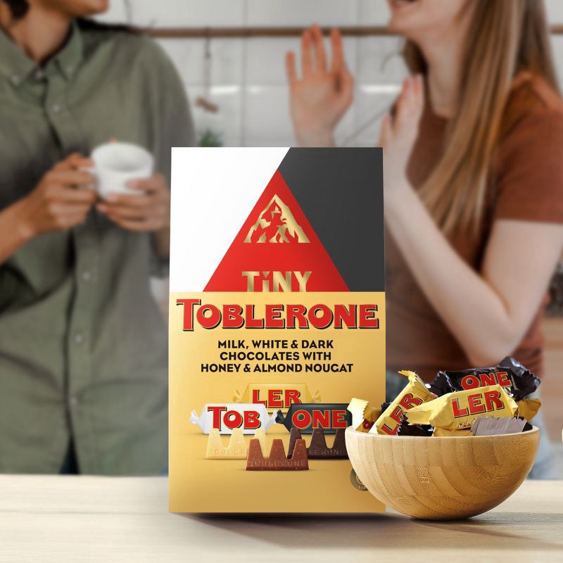 slide 15 of 15, TOBLERONE Tiny Assorted Chocolate Bars Variety Pack (Milk, Dark, & White), 1 Gift Bag (15 Pieces), 4.23 oz