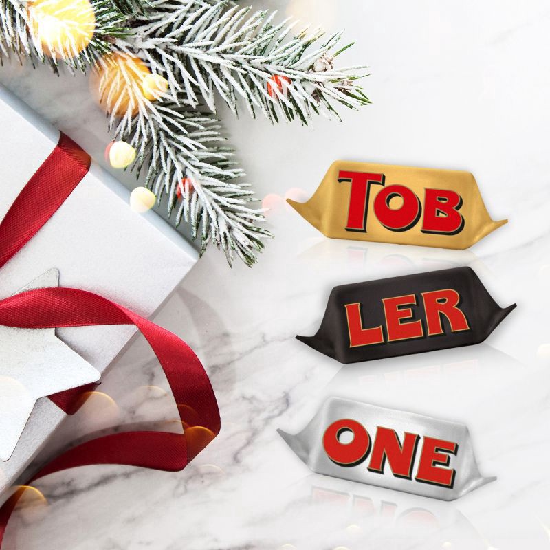 slide 5 of 15, TOBLERONE Tiny Assorted Chocolate Bars Variety Pack (Milk, Dark, & White), 1 Gift Bag (15 Pieces), 4.23 oz