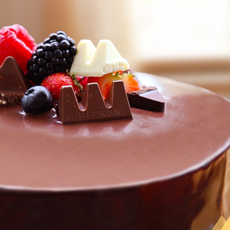 slide 2 of 15, TOBLERONE Tiny Assorted Chocolate Bars Variety Pack (Milk, Dark, & White), 1 Gift Bag (15 Pieces), 4.23 oz