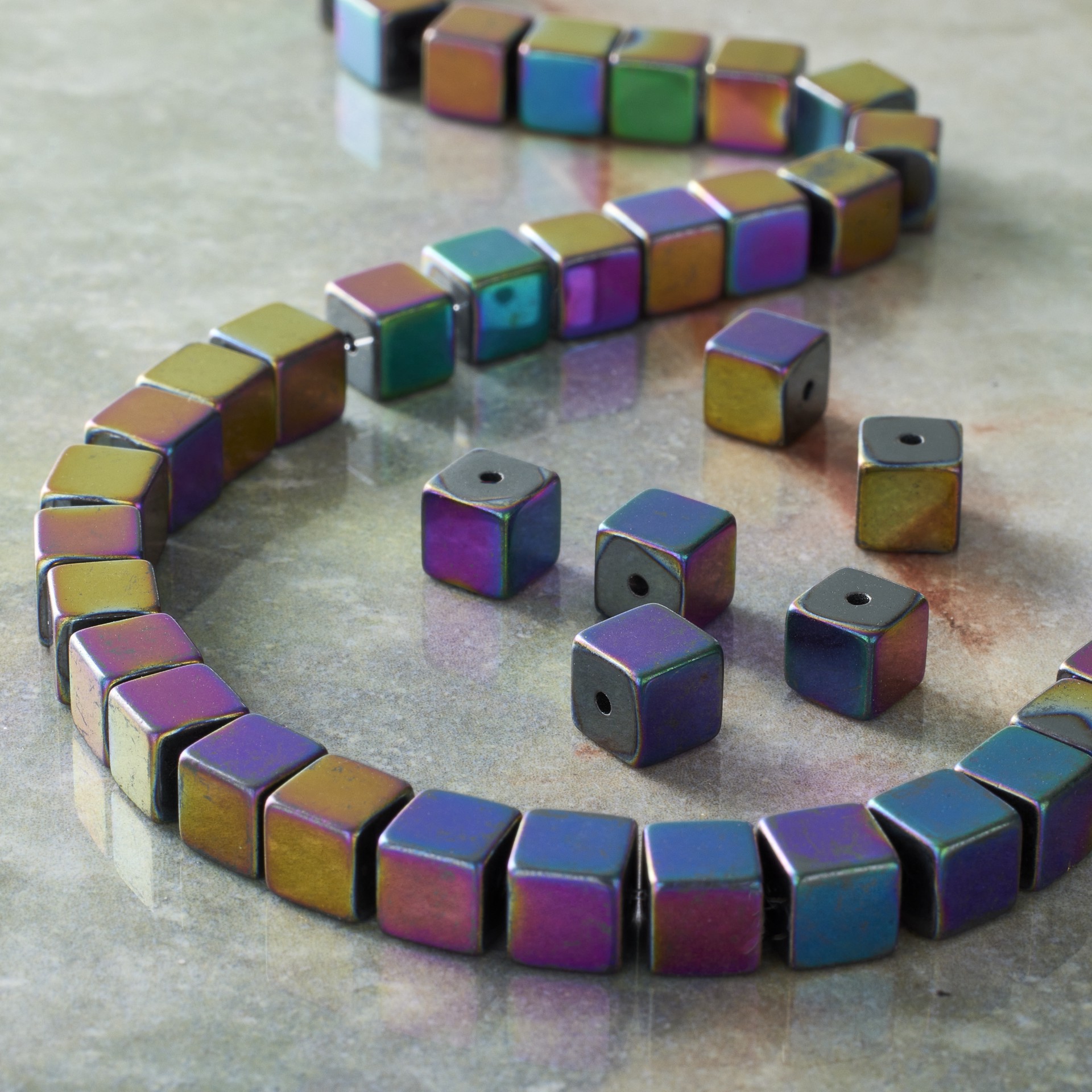 slide 3 of 3, Rainbow Reconstituted Hematite Cube Beads By Bead Landing, 6 mm