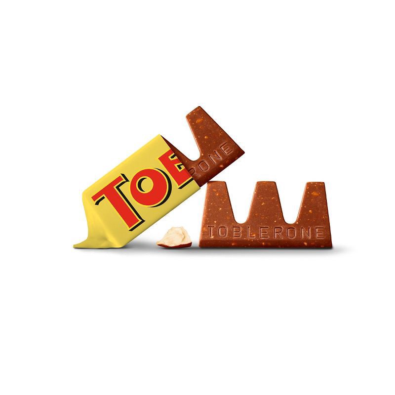 slide 7 of 14, TOBLERONE Tiny Milk Chocolate Bars with Honey and Almond Nougat, 1 Gift Bag (18 Pieces), 5.07 oz