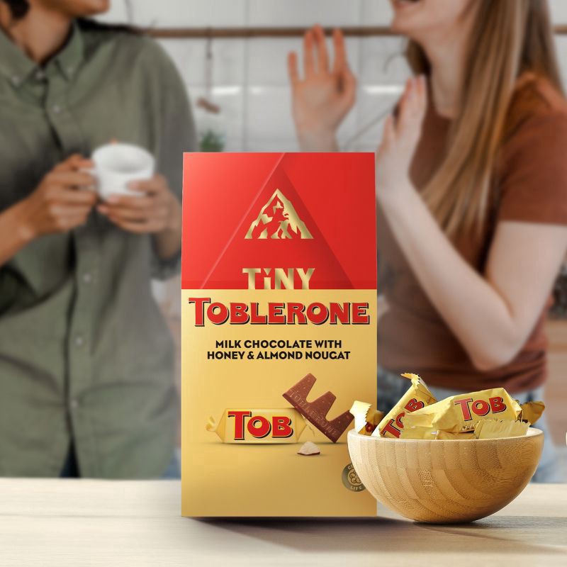 slide 14 of 14, TOBLERONE Tiny Milk Chocolate Bars with Honey and Almond Nougat, 1 Gift Bag (18 Pieces), 5.07 oz