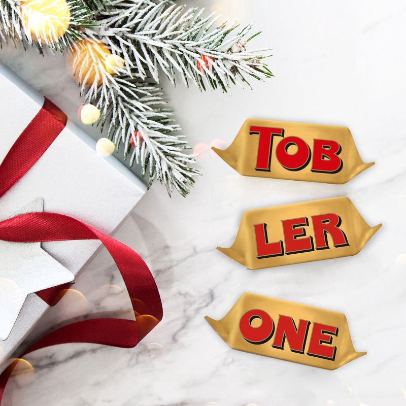 slide 4 of 14, TOBLERONE Tiny Milk Chocolate Bars with Honey and Almond Nougat, 1 Gift Bag (18 Pieces), 5.07 oz