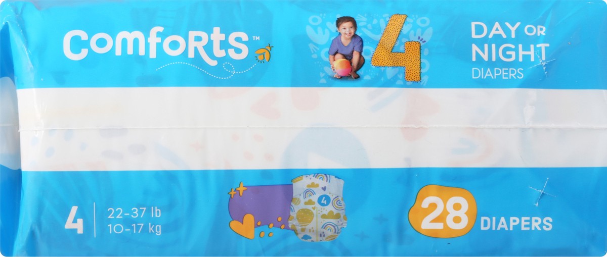 slide 11 of 13, Comforts Size 4 Day Or Night Baby Diapers, 28 ct