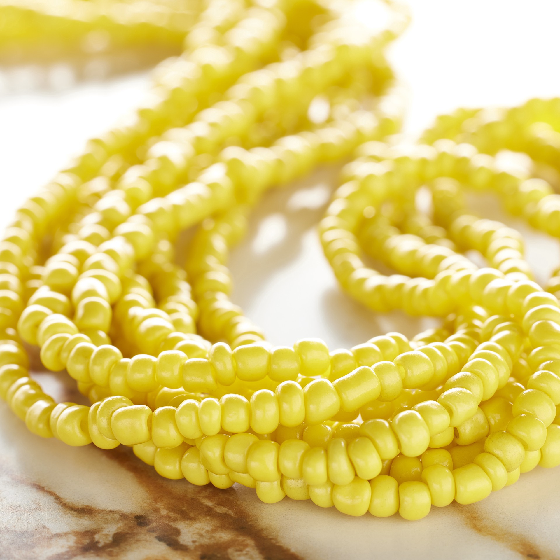 slide 2 of 3, Yellow Glass Rondelle Seed Beads, 6/0 By Bead Landing, 6/0