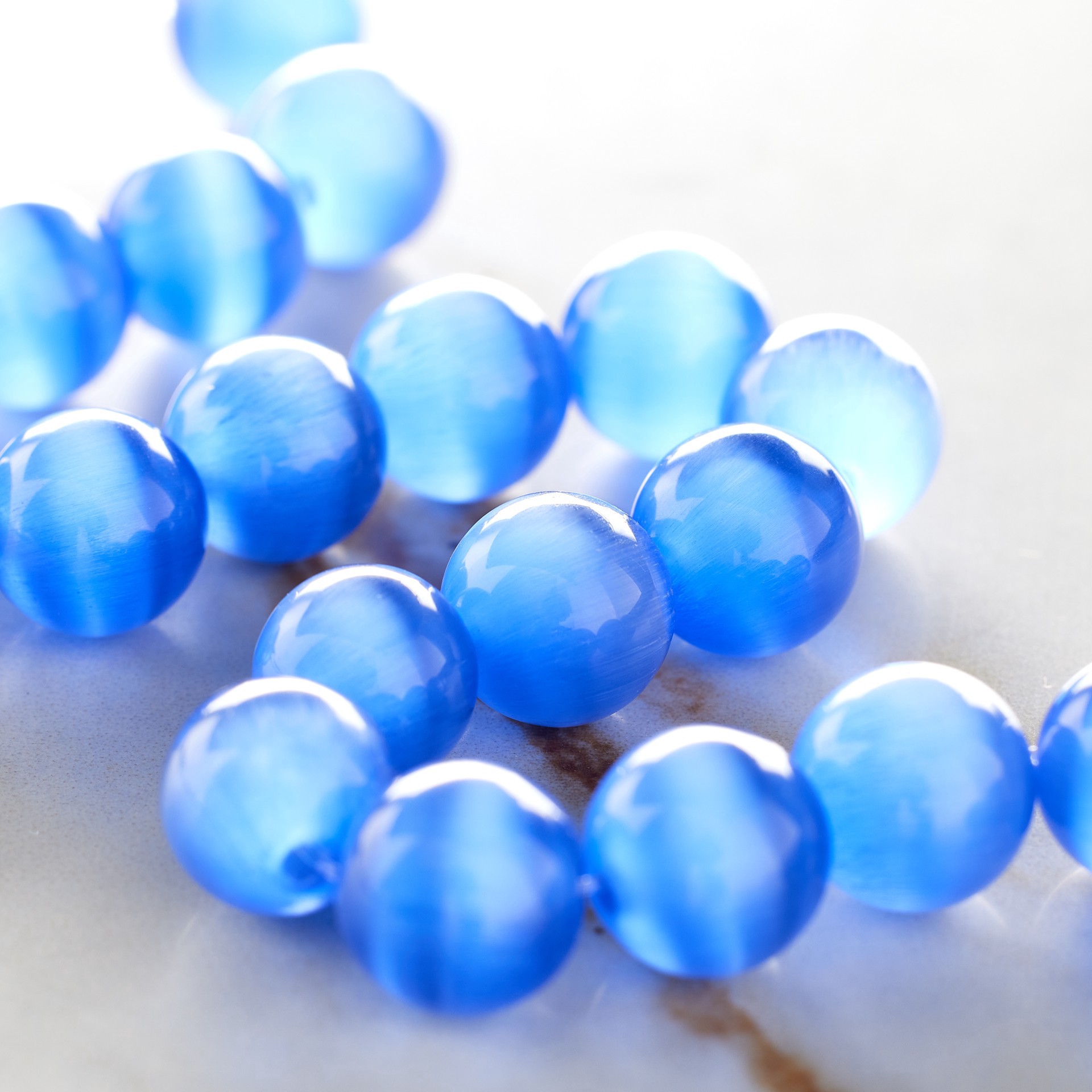 slide 2 of 3, Light Sapphire Cat's Eye Glass Round Beads, 10mm By Bead Landing, 10mm