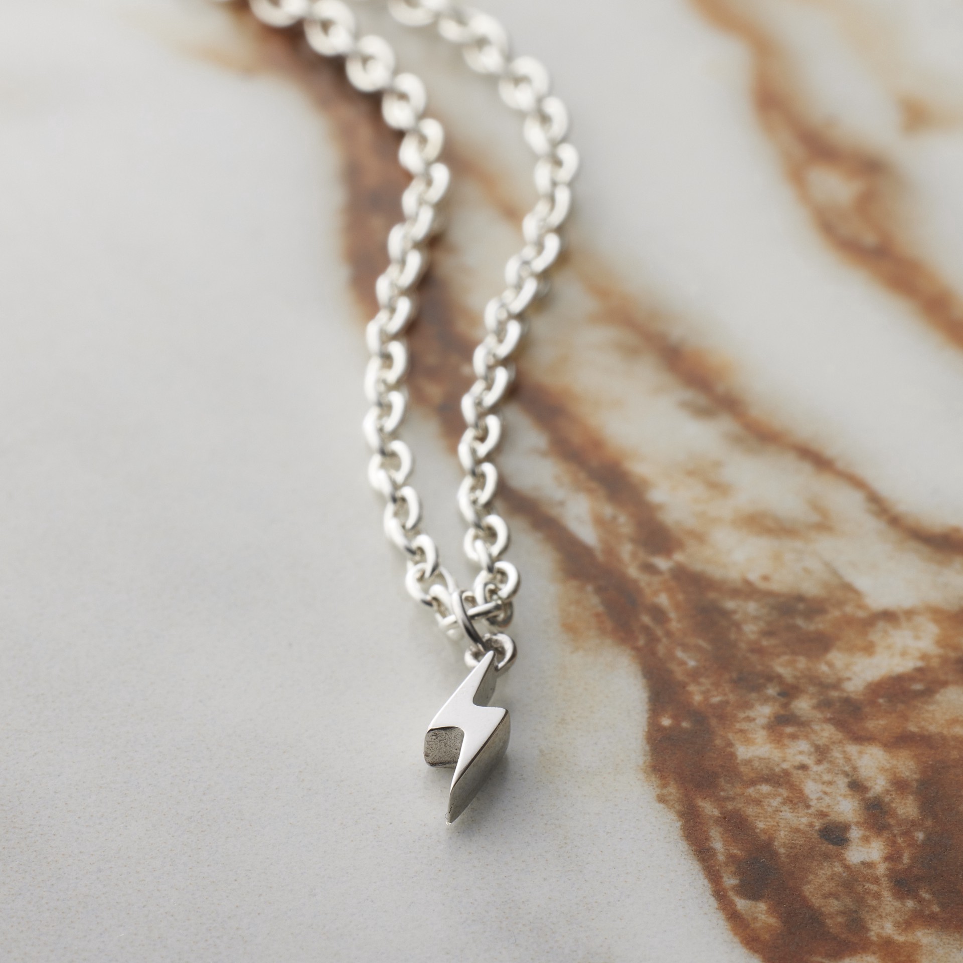 slide 2 of 8, Sterling Silver Bolt Icon Charm By Bead Landing, 0.13 in x 0.4 in x 0.09 in