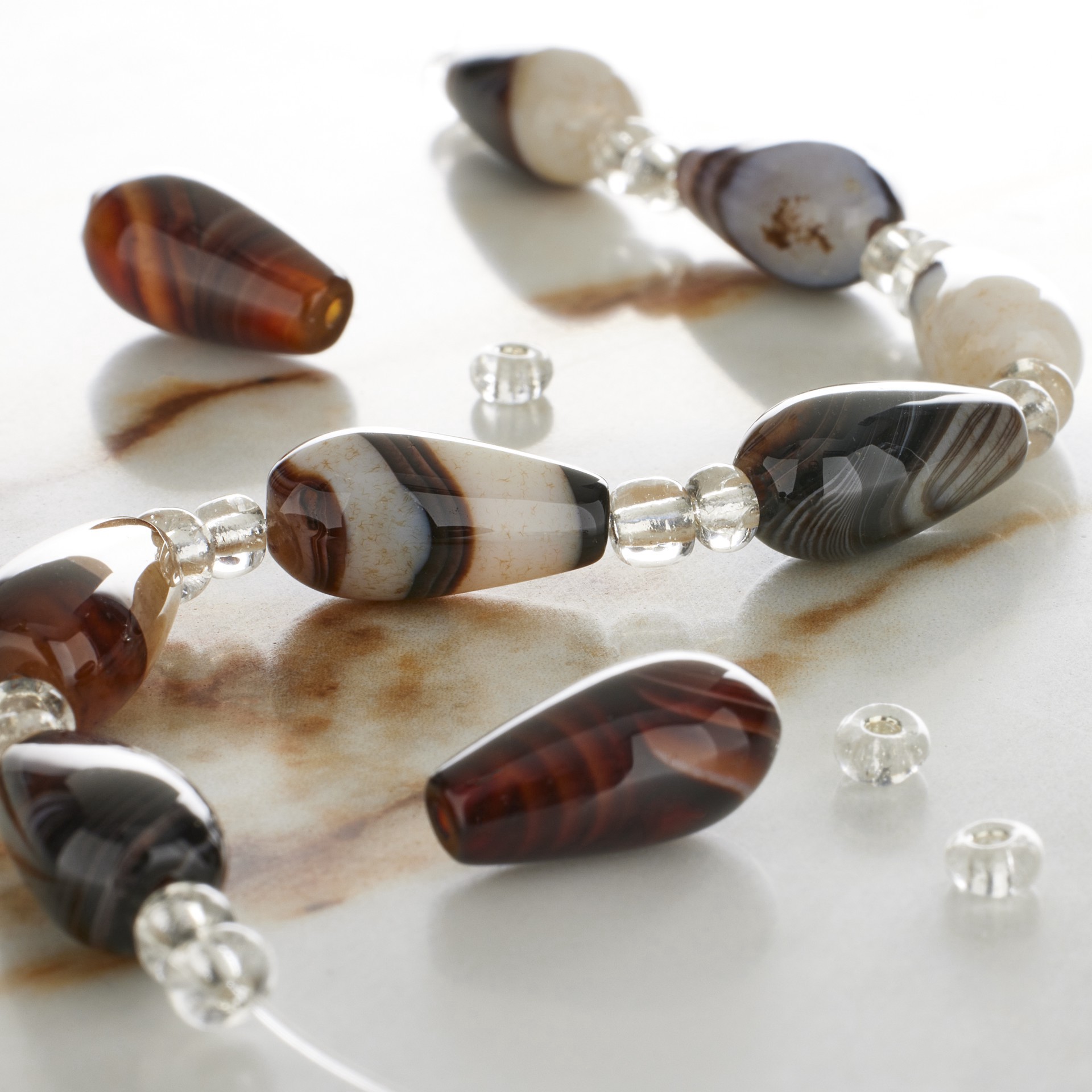 slide 2 of 3, Brown Striped Dyed Agate Teardrop Beads, 8mm By Bead Landing, 8mm