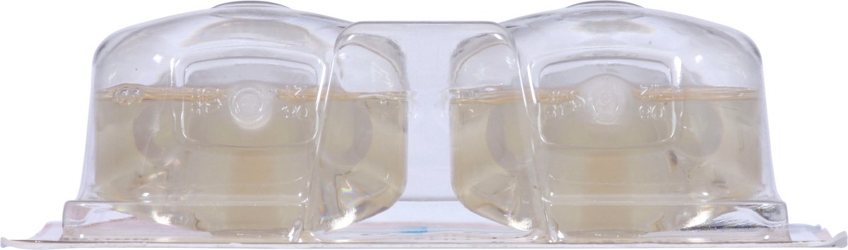 slide 10 of 13, Glade PlugIns Scented Oil 2 Refills, Air Freshener, Vanilla Caramel Twist, 2 x 0.67 oz, 1.34 fl oz