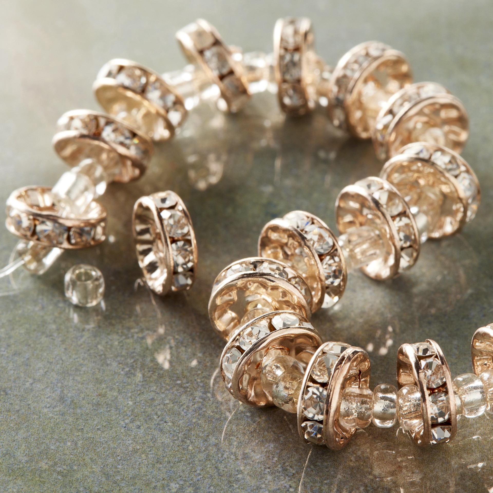 slide 2 of 3, Rose Gold Rhinestone Studded Rondel Beads, 10mm By Bead Landing, 10mm